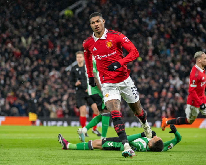 Marcus Rashford pictured celebrating after scoring for Manchester United against Real Betis in the 2022/23 UEFA Europa League round of 16 at Old Trafford